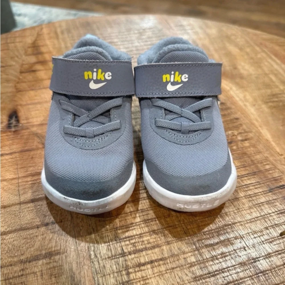 Kids Gray Nikes with lightning bolt